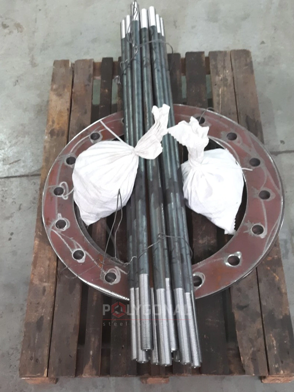 A disassembled anchor cage: the ring and the anchor bolts in packaging