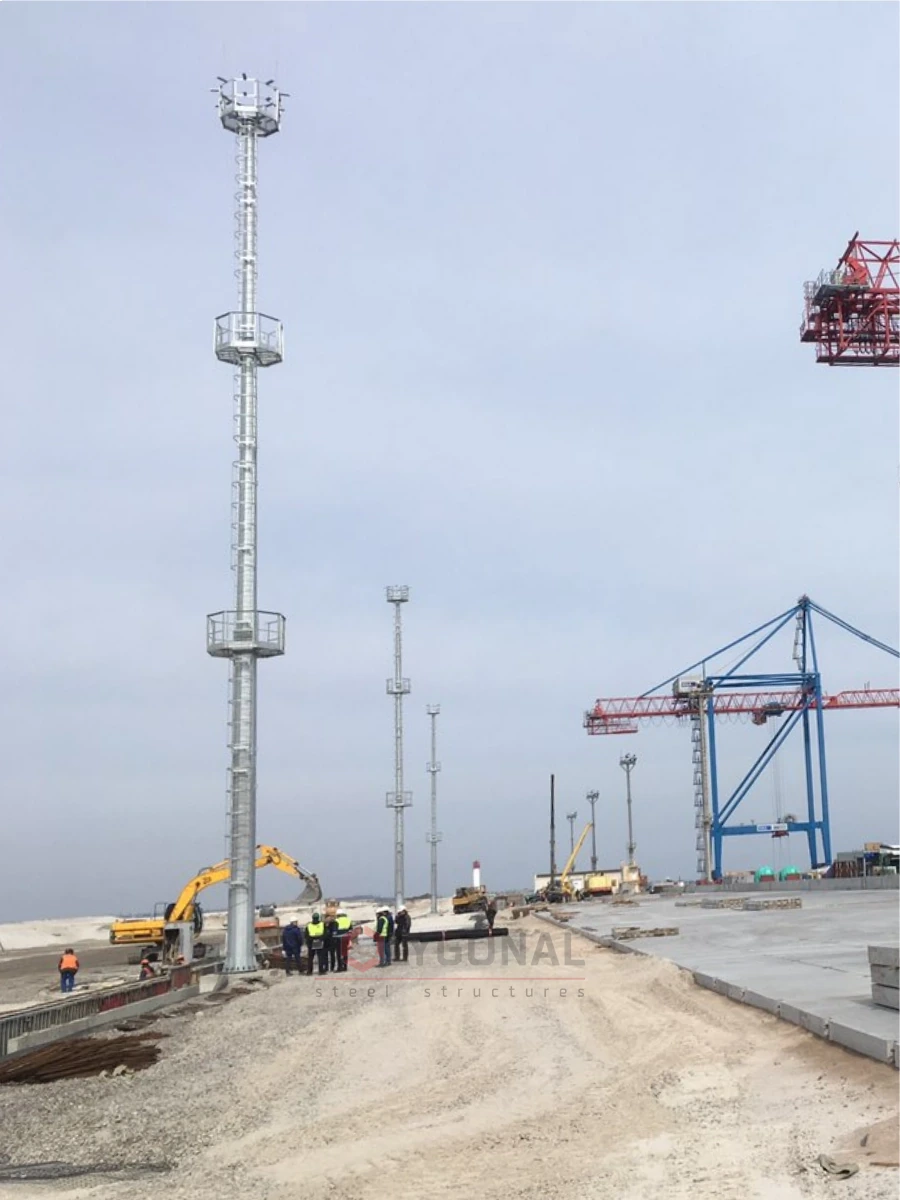 Installed floodlight masts at a sea port site
