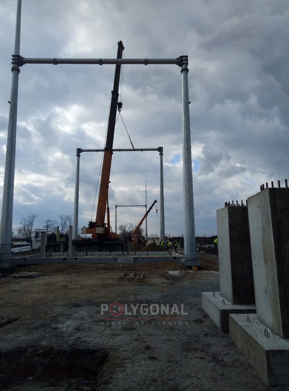An erected gantry and the crane on site