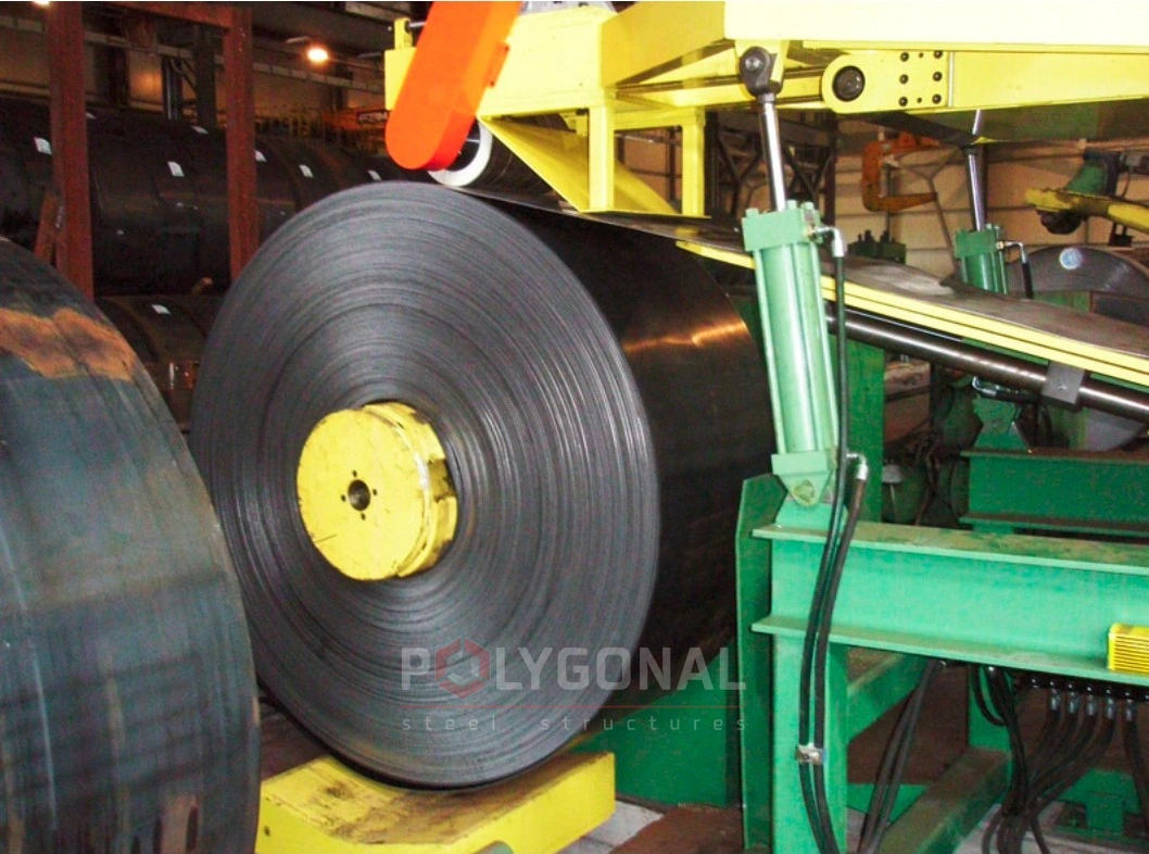 A steel strip coil on the uncoiler of a road barrier line
